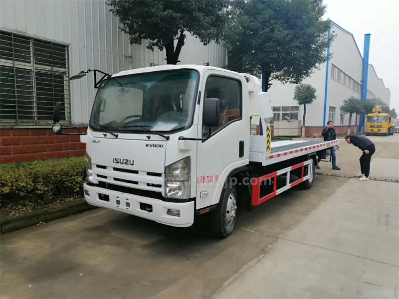 Isuzu KV600 flatbed wrecker photo